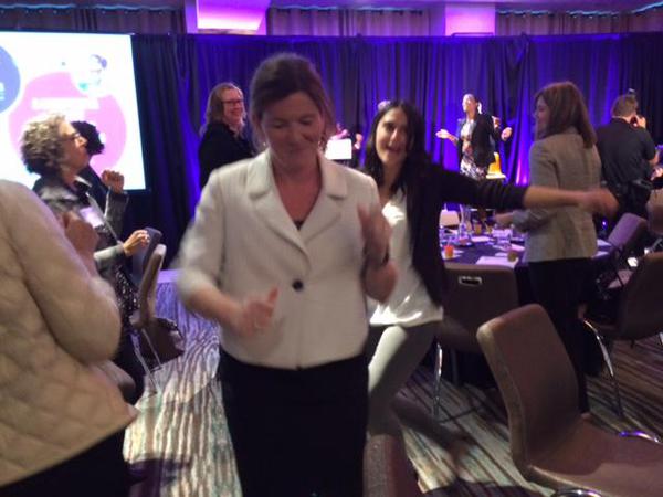 To celebrate the end of the convening, Susie Loftus leads the participants in dancing. 