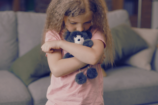 Sad girl with teddy bear - 