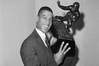 Ernie Davis becomes the first African-American to win the Heisman Trophy