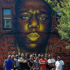 Black men running mural group pic