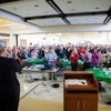 Patsy Sellars leads a "brain break": Patsy Sellars, Casey Family Programs, leads a group of 400 in brain stimulating activity
