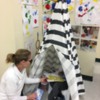 Calm Down Tent: Katy, teacher at Kiddie Academy of Bridgewater, connects with a child in the Calm Down Tent!