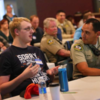 Nathan Dyer and Sheriffs deputy Anthony Diehm: Nathan Dyer speaks at the Be Safe training while Sheriff's Deputy Anthony Diehm looks on